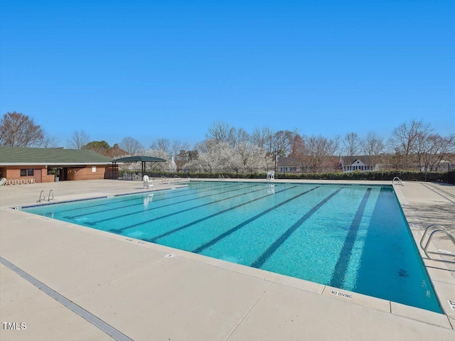 community pool featuring a patio area