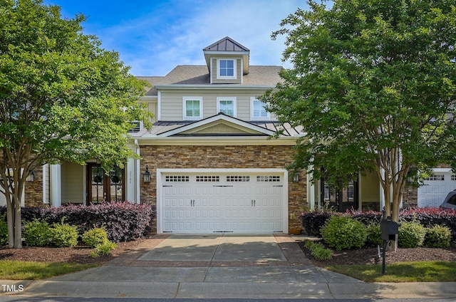 view of front of property with a standing seam roof, driveway, metal roof, and stone siding