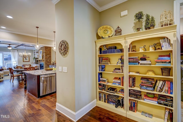 corridor with baseboards, dark wood-style floors, a notable chandelier, ornamental molding, and recessed lighting