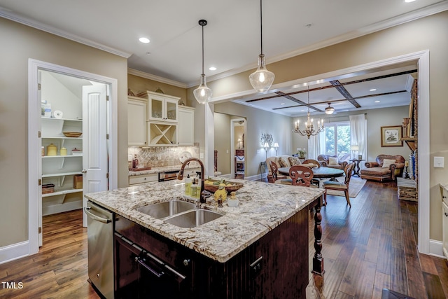 kitchen with crown molding, stainless steel dishwasher, a sink, dark wood-style floors, and coffered ceiling