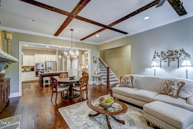 living area with dark wood finished floors, stairs, a chandelier, and coffered ceiling