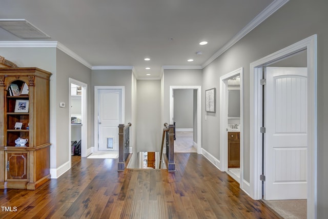 corridor with visible vents, baseboards, dark wood-type flooring, recessed lighting, and an upstairs landing