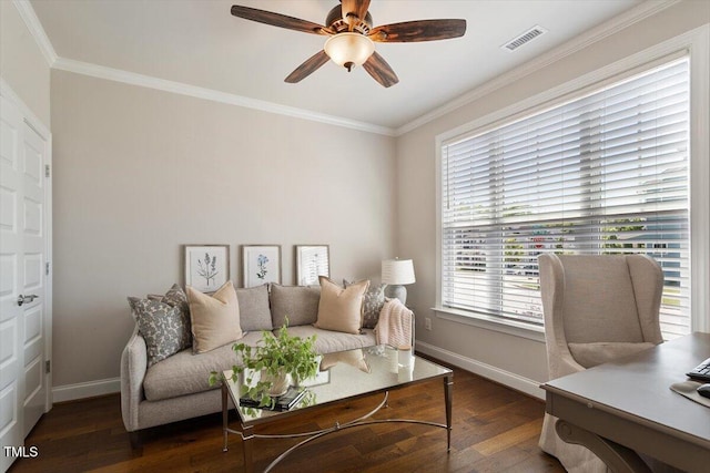 living area featuring wood-type flooring, ceiling fan, crown molding, and baseboards