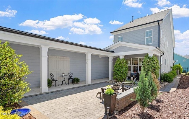 rear view of house featuring a patio area