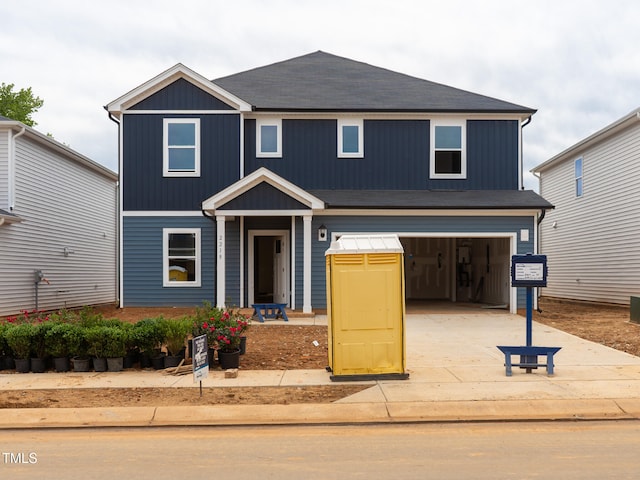 2218 Cherry Creek Rd, Haw River, NC 27258 - view of front of property with concrete driveway, an attached garage, and roof with shingles