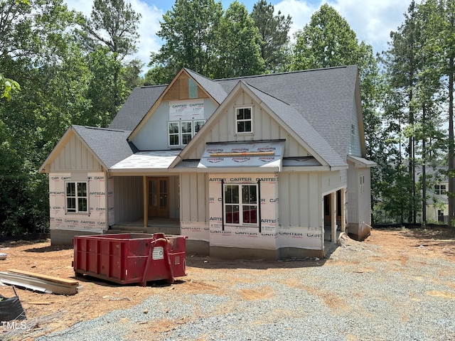 485 Chapel Ridge Dr, Pittsboro, NC 27312 - property under construction featuring board and batten siding, roof with shingles, and a porch