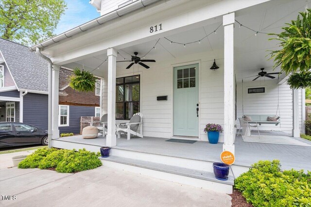 property entrance featuring covered porch and ceiling fan