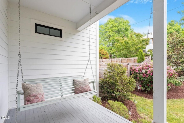 wooden deck featuring fence