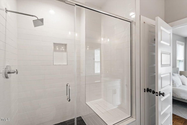 bathroom with a stall shower and ensuite bath