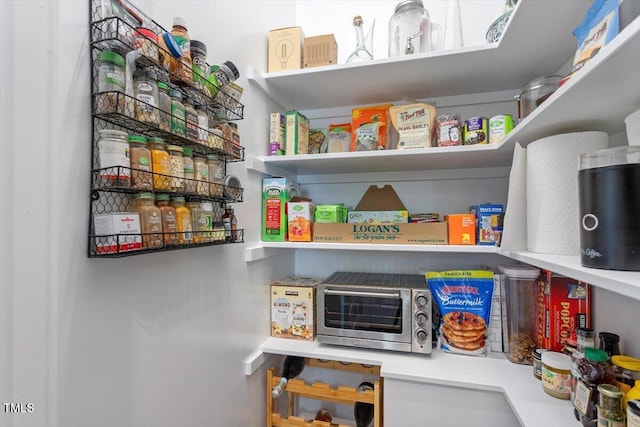 storage area featuring a toaster