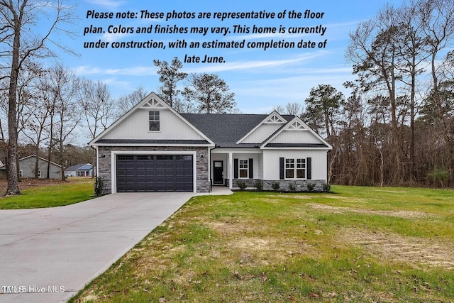3803 Huntcliff Dr, La Grange, NC 28551 - craftsman-style home with concrete driveway, a front lawn, an attached garage, and stone siding