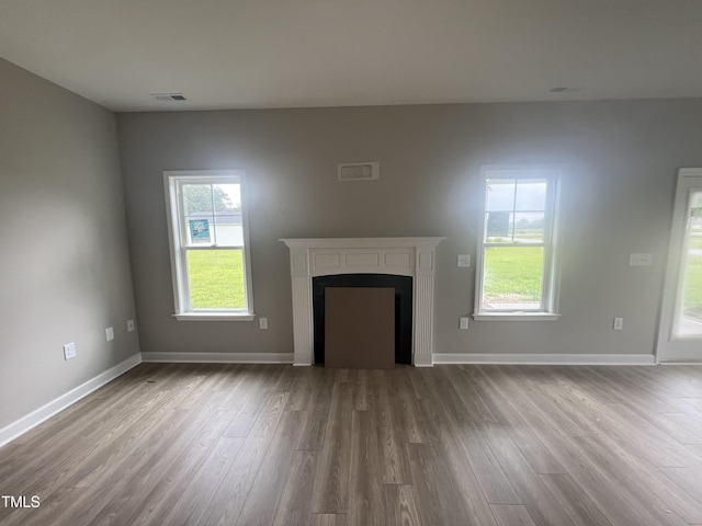 3803 Huntcliff Dr, La Grange, NC 28551 - unfurnished living room with dark wood-type flooring, a fireplace, and baseboards