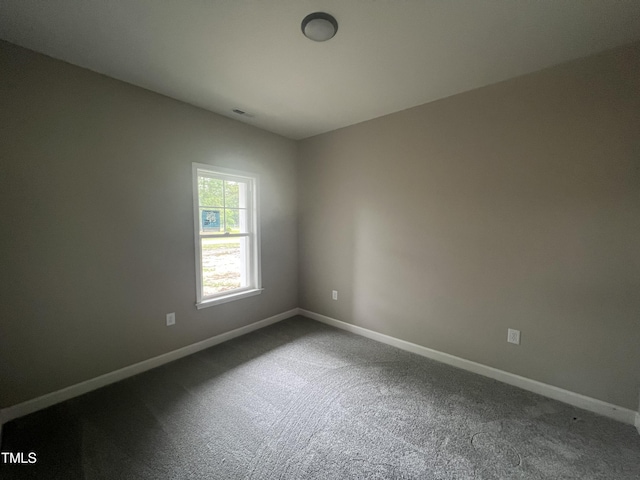 3803 Huntcliff Dr, La Grange, NC 28551 - spare room with baseboards and dark carpet