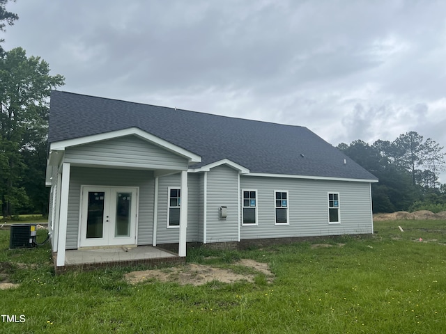 3803 Huntcliff Dr, La Grange, NC 28551 - back of property featuring a yard, french doors, a shingled roof, and central AC
