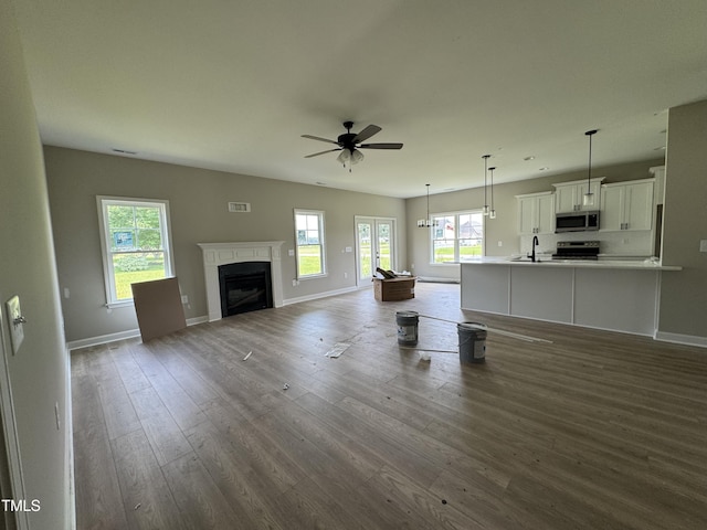 3803 Huntcliff Dr, La Grange, NC 28551 - living area with ceiling fan, dark wood-style floors, and a fireplace