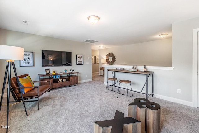 carpeted living room with baseboards and visible vents