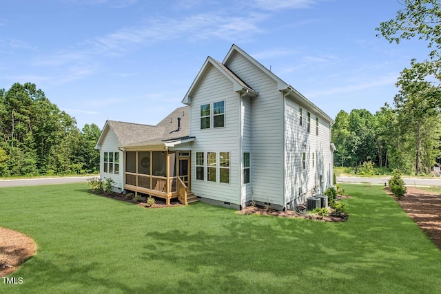 back of house with a yard, central AC unit, a sunroom, and crawl space
