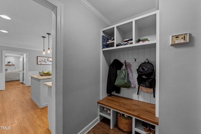 2409 Beechview Ct, Raleigh, NC 27615 - mudroom with crown molding, light wood finished floors, and baseboards