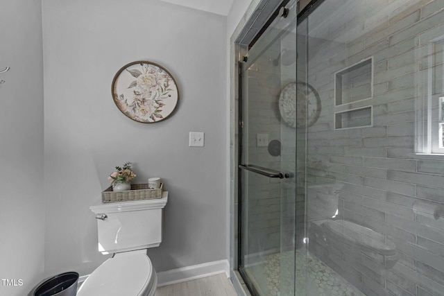 2409 Beechview Ct, Raleigh, NC 27615 - full bath featuring toilet, a stall shower, and baseboards