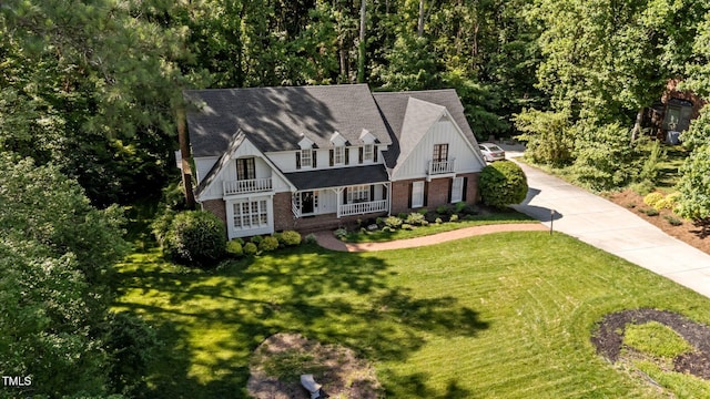 2409 Beechview Ct, Raleigh, NC 27615 - view of front of property featuring a porch, a front yard, and brick siding