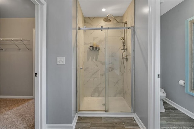 1403 Bosden Pl, Fayetteville, NC 28314 - bathroom with toilet, a marble finish shower, and baseboards