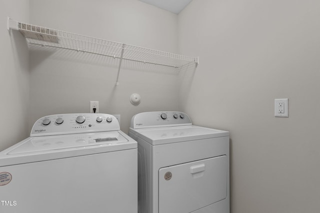 laundry area featuring washer and dryer and laundry area