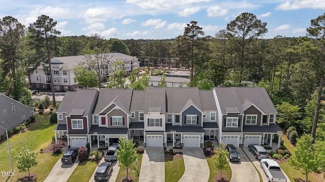 bird's eye view with a residential view and a view of trees