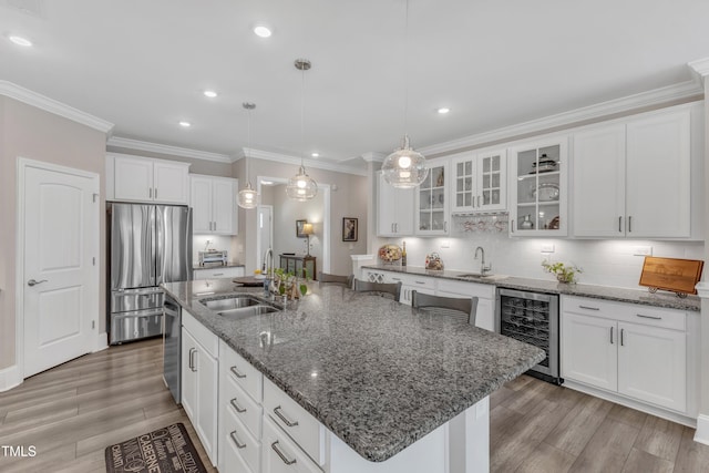 704 Haven Peak Ln, Wake Forest, NC 27587 - kitchen featuring beverage cooler, stainless steel appliances, white cabinets, crown molding, and light wood-style floors
