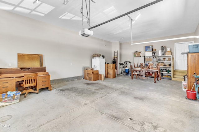 704 Haven Peak Ln, Wake Forest, NC 27587 - garage with a garage door opener and freestanding refrigerator