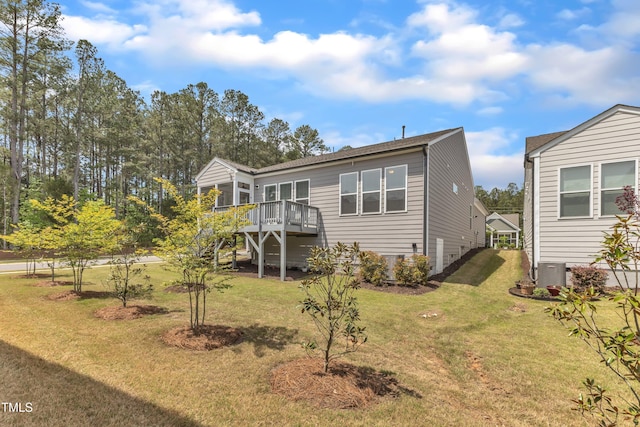 704 Haven Peak Ln, Wake Forest, NC 27587 - rear view of house with a wooden deck and a lawn