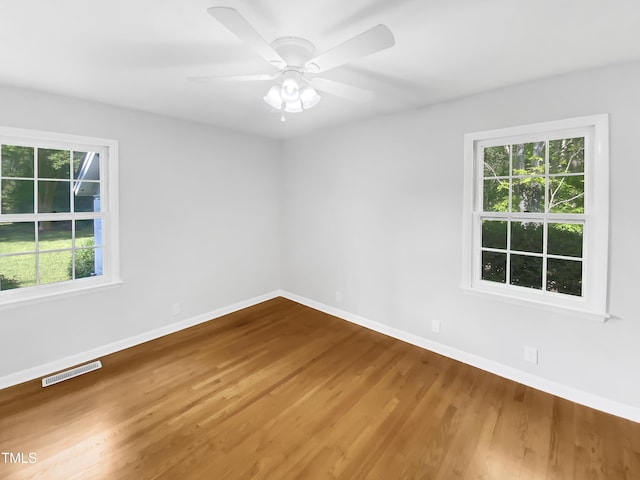 3504 Crofton Ct, Raleigh, NC 27604 - spare room with baseboards, wood finished floors, visible vents, and a wealth of natural light