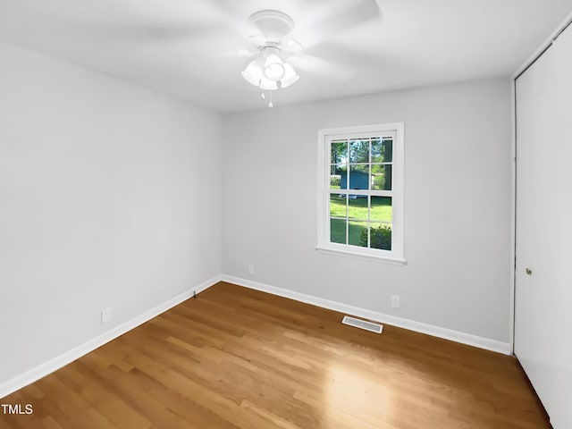 3504 Crofton Ct, Raleigh, NC 27604 - spare room featuring baseboards, wood finished floors, visible vents, and a ceiling fan