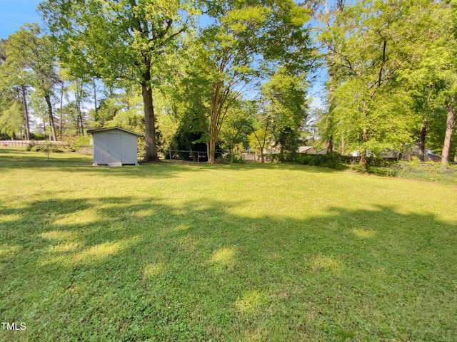 3504 Crofton Ct, Raleigh, NC 27604 - view of yard featuring fence, an outdoor structure, and a storage shed