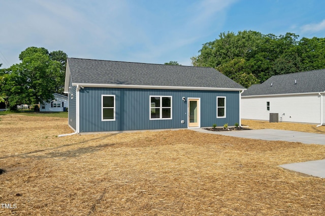 view of front of property featuring a shingled roof and central AC unit