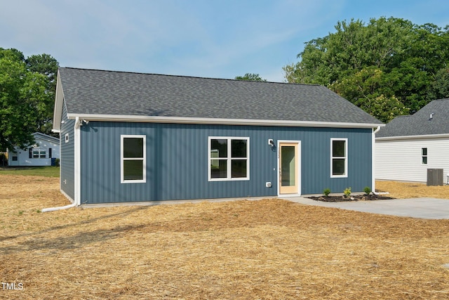 view of front of property with roof with shingles and cooling unit