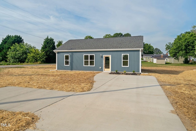 view of front of house with a shingled roof