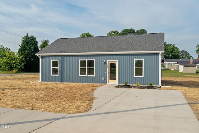 view of front of home featuring roof with shingles