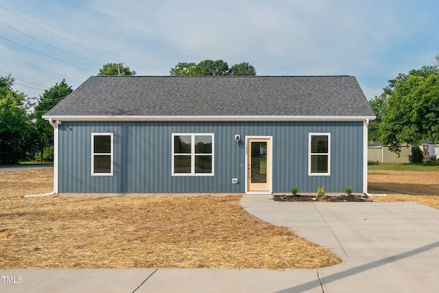 view of front of house featuring roof with shingles and board and batten siding