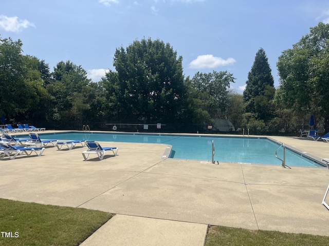 1002 Dogwood Bloom Ln, Knightdale, NC 27545 - community pool featuring a patio area