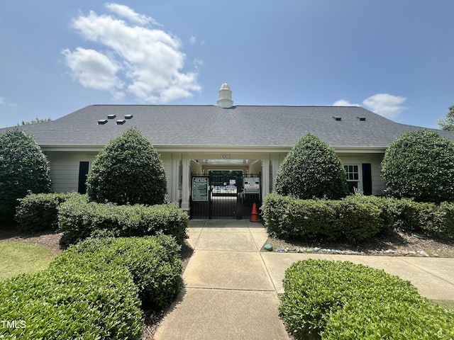 1002 Dogwood Bloom Ln, Knightdale, NC 27545 - view of front of house featuring a gate and a shingled roof