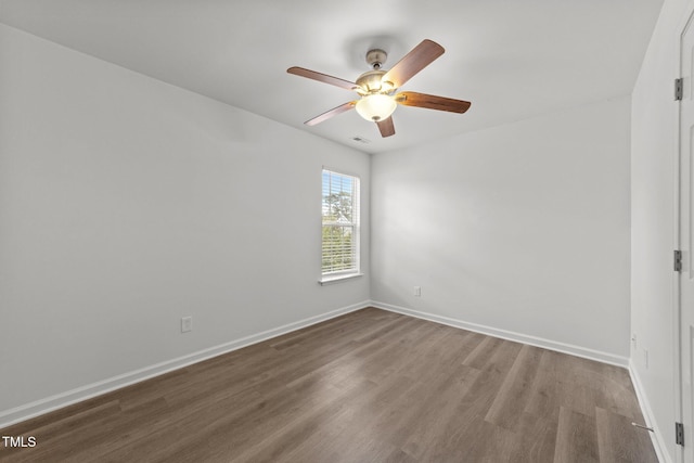 620 Hanska Way, Raleigh, NC 27610 - spare room featuring a ceiling fan, wood finished floors, and baseboards