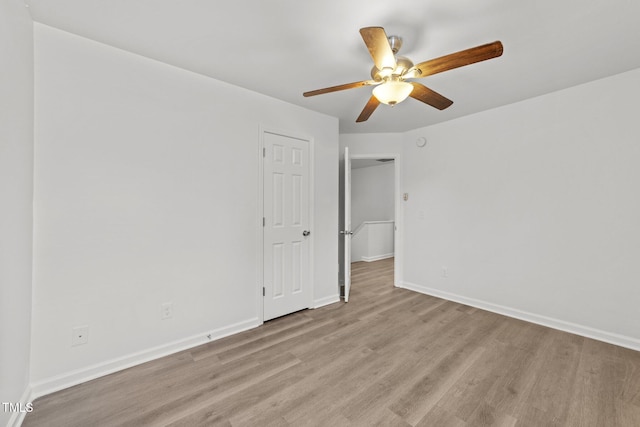 620 Hanska Way, Raleigh, NC 27610 - spare room featuring light wood-style floors, a ceiling fan, and baseboards
