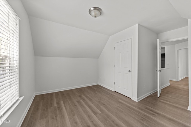 620 Hanska Way, Raleigh, NC 27610 - bonus room with plenty of natural light, wood finished floors, vaulted ceiling, and baseboards