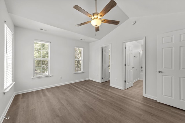 620 Hanska Way, Raleigh, NC 27610 - unfurnished bedroom with wood finished floors, vaulted ceiling, and baseboards