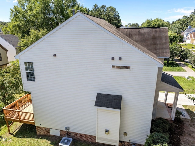 620 Hanska Way, Raleigh, NC 27610 - view of side of property featuring a shingled roof, a wooden deck, and crawl space