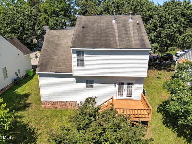620 Hanska Way, Raleigh, NC 27610 - back of property featuring french doors, a deck, a lawn, and a shingled roof