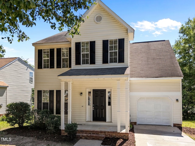 620 Hanska Way, Raleigh, NC 27610 - view of front facade with covered porch, a shingled roof, a garage, and driveway