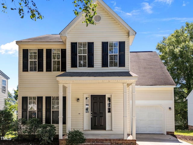 620 Hanska Way, Raleigh, NC 27610 - view of front of home with a shingled roof, concrete driveway, covered porch, and an attached garage