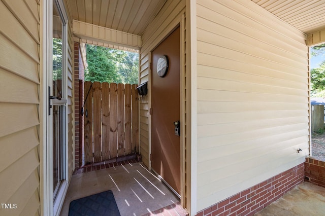property entrance featuring fence and a gate