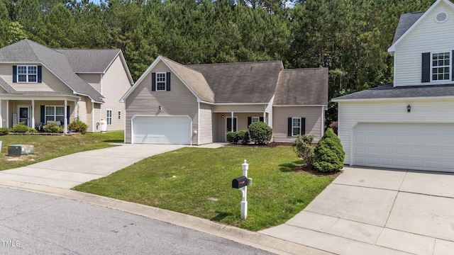 633 Prickly Pear Dr, Fuquay Varina, NC 27526 - traditional home with concrete driveway, a front lawn, an attached garage, and a shingled roof